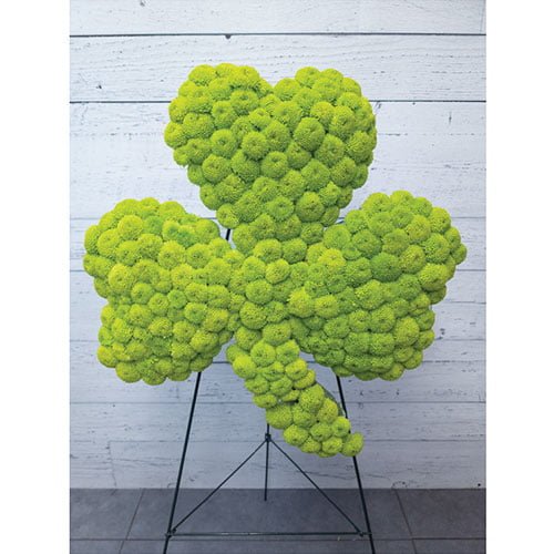 Trèfle composé de pompons verts